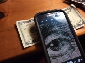 Cell Phone taking pic of money